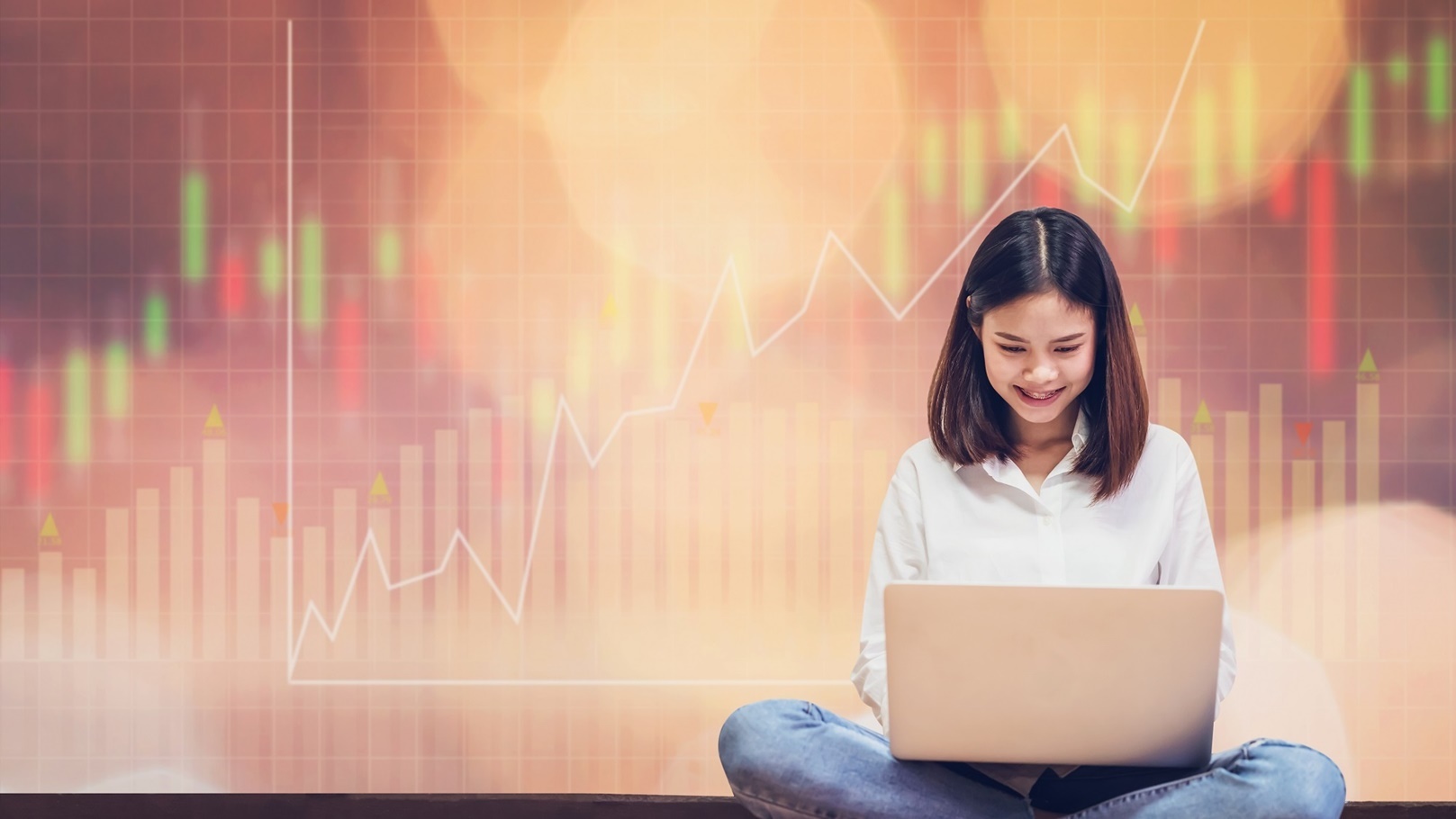 woman-sitting-using-laptop-and-show-trading-graph-2021-09-01-18-14-31-utc