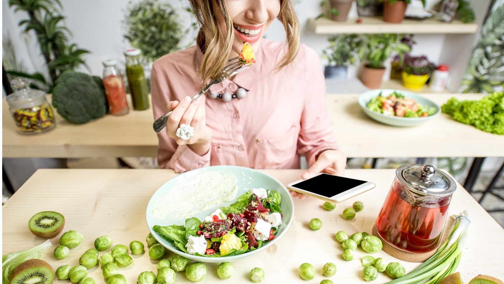 woman-eating-salad-2021-12-23-15-30-10-utc