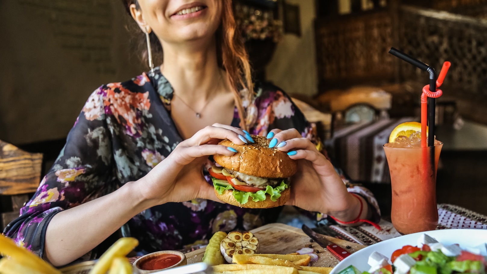 side-view-woman-eating-meat-burger-with-fries-ketc-2021-08-31-16-11-29-utc