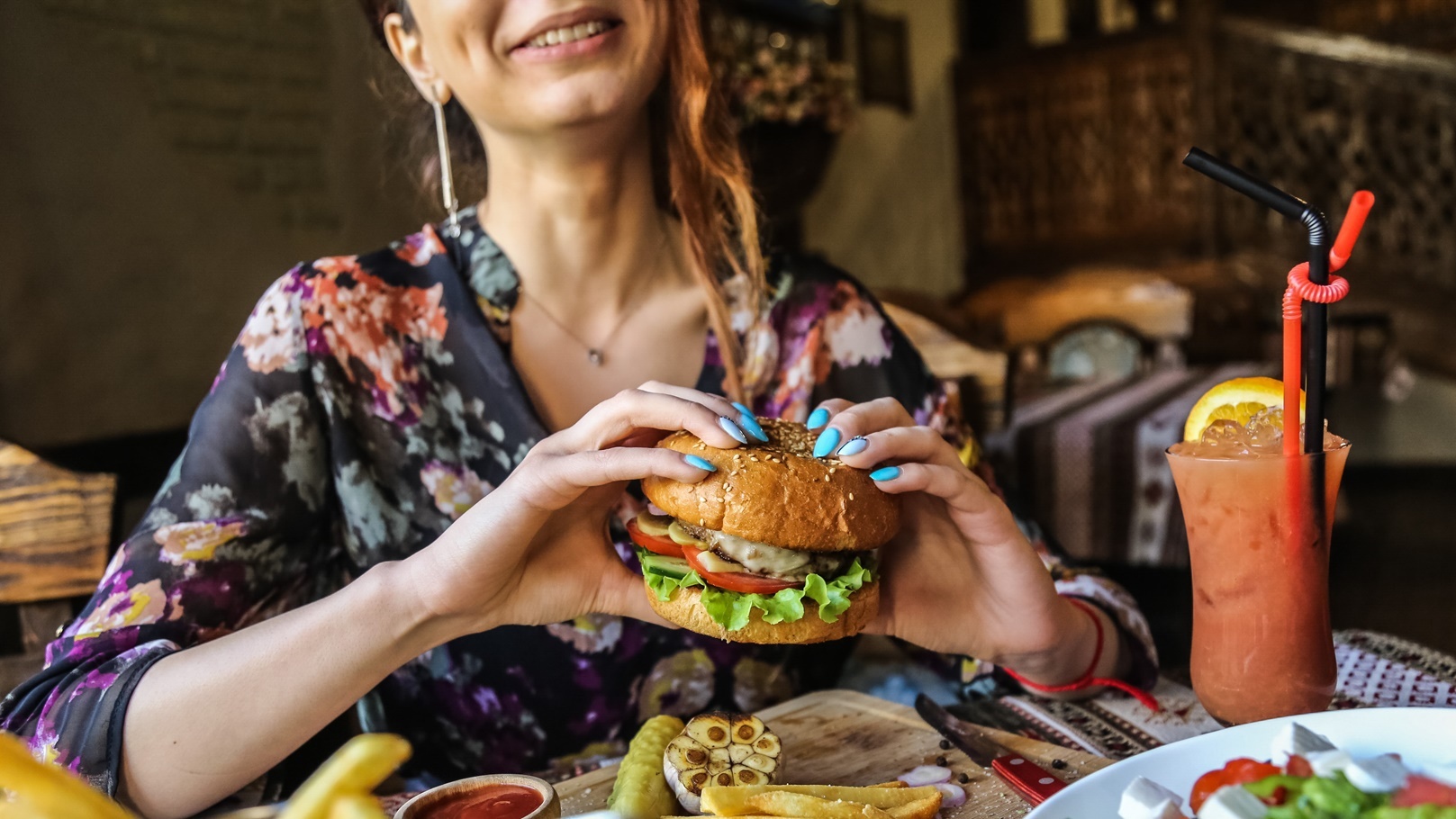 side-view-woman-eating-meat-burger-with-fries-ketc-2021-08-31-16-11-29-utc