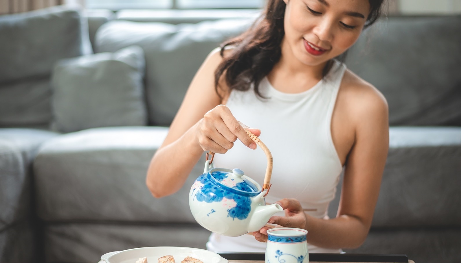 asian-woman-person-relaxing-with-hot-tea-to-drink-2022-01-18-23-59-58-utc