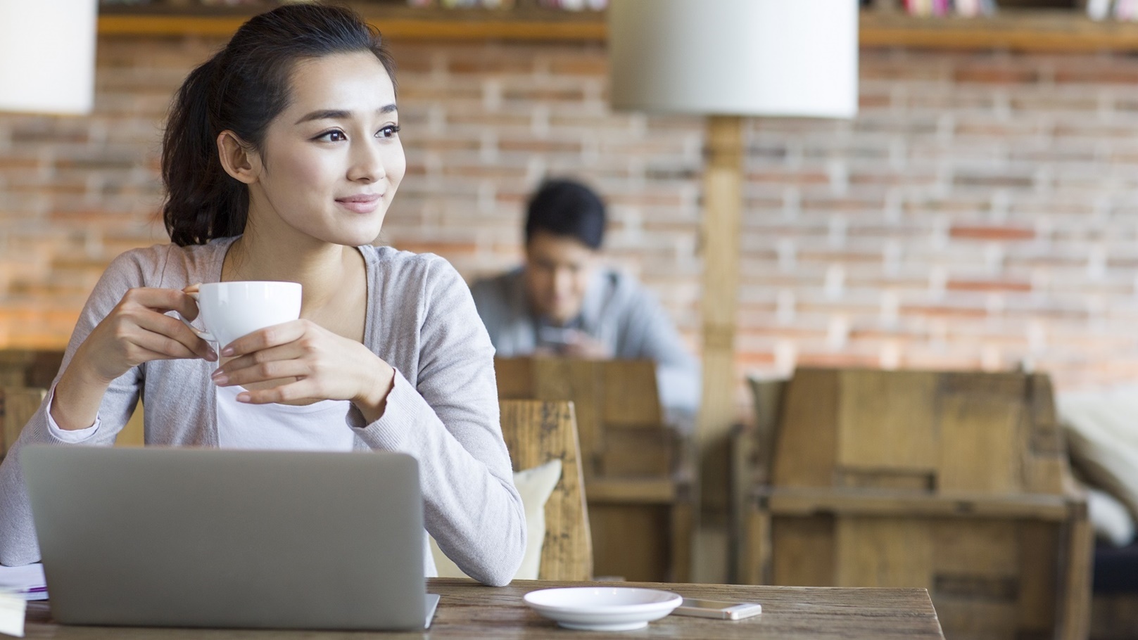 young-woman-drinking-coffee-in-cafe-2022-03-31-23-10-04-utc