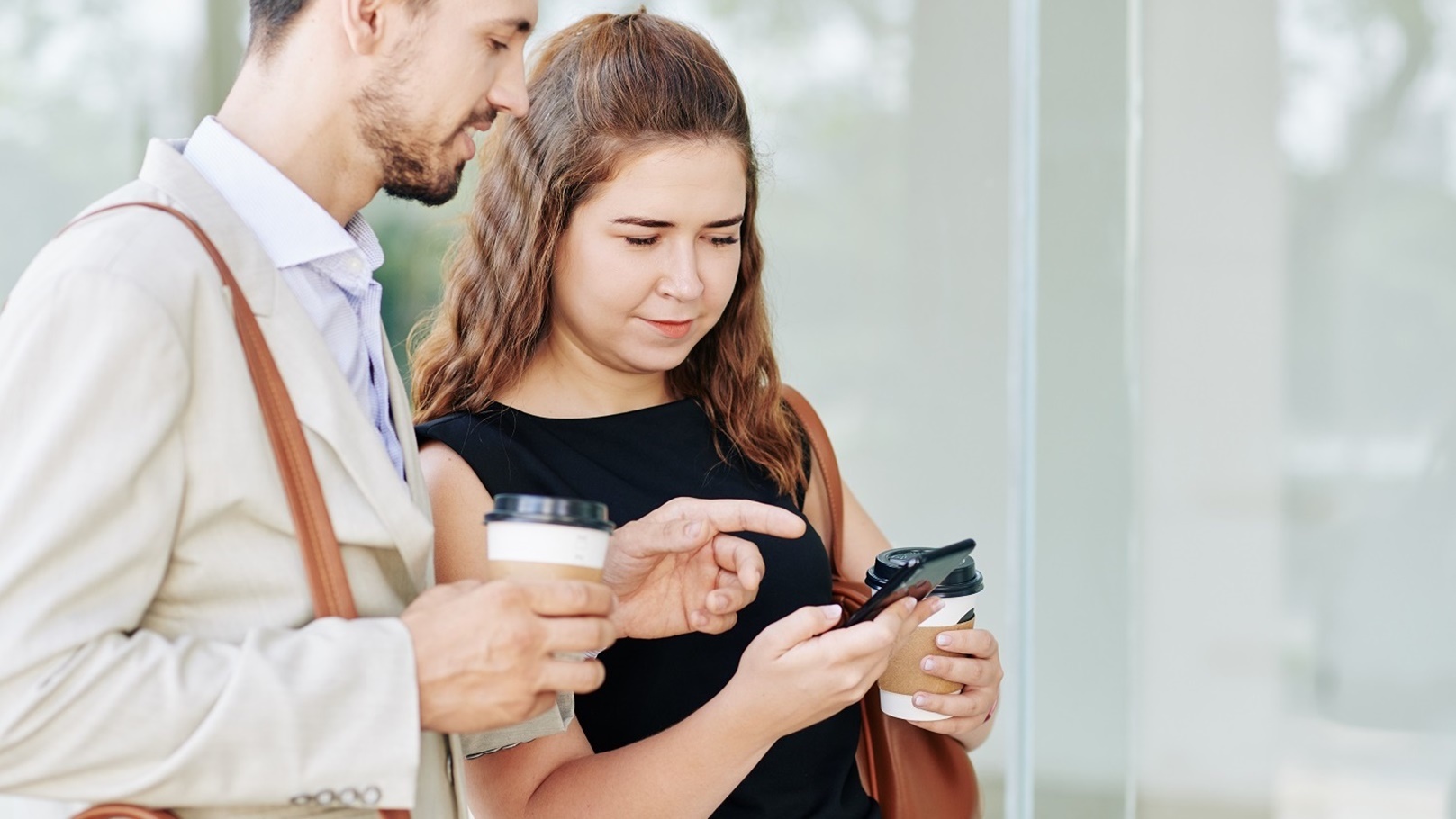 coworkers-discussing-mobile-application-2021-08-29-10-59-02-utc