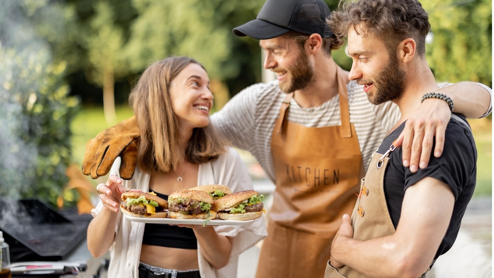 friends-enjoy-burgers-on-a-picnic-2021-09-04-12-15-51-utc