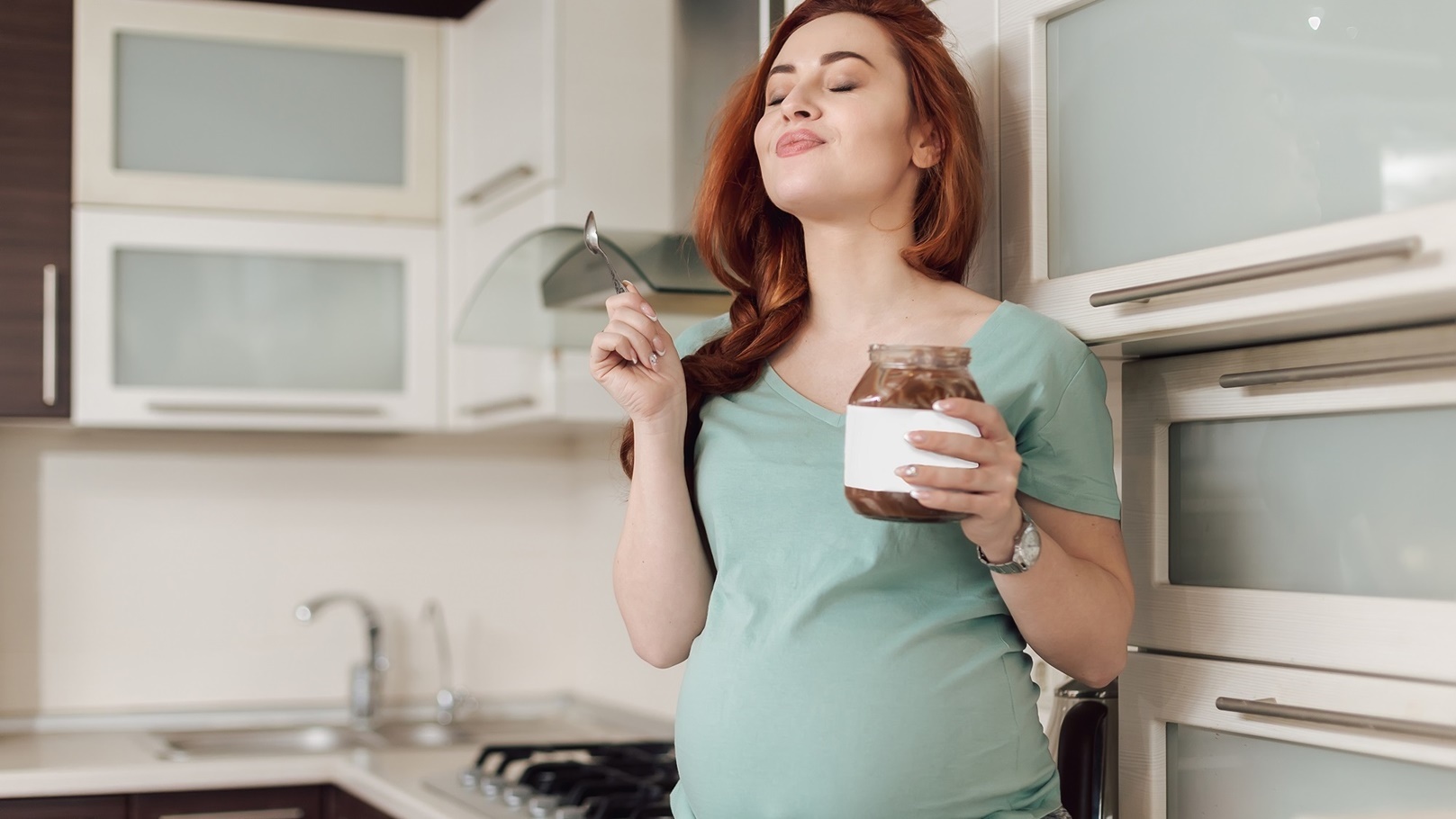pregnant-woman-enjoying-eating-chocolate-2021-08-29-17-36-20-utc