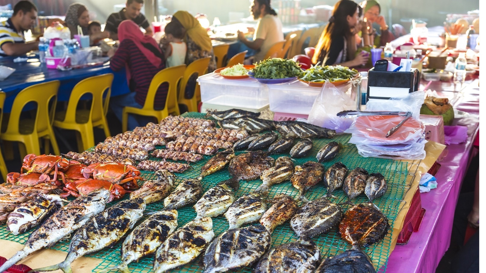 grilled-fish-on-a-table-at-a-food-market-restauran-2022-03-04-02-19-54-utc