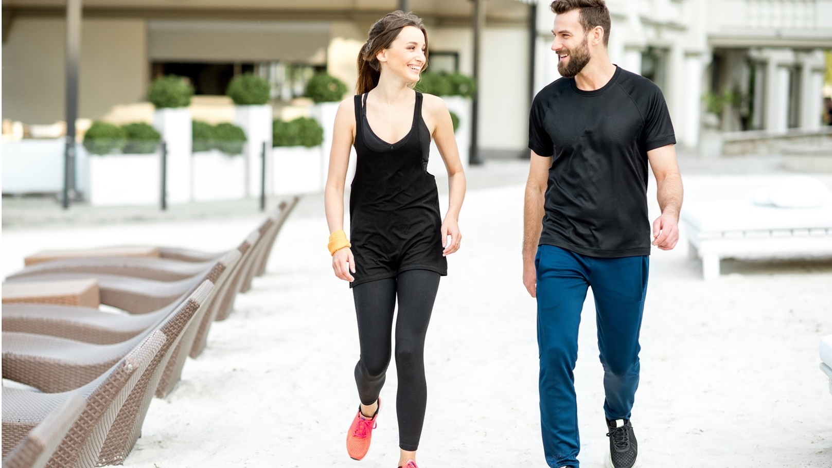 sports-couple-walking-in-the-beach-2021-12-09-17-35-32-utc