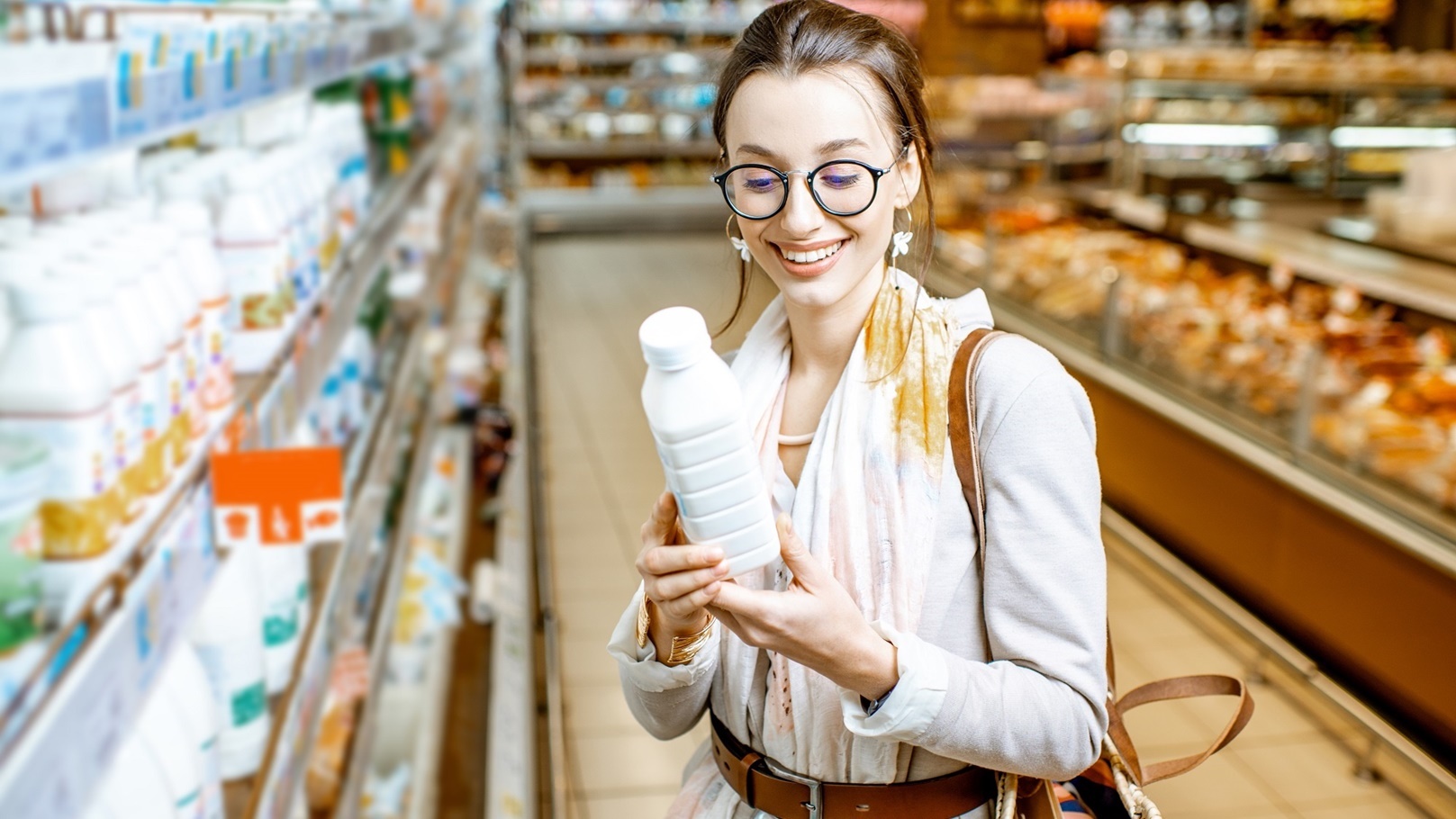 woman-buying-milk-in-the-supermarket-2022-01-19-00-17-48-utc