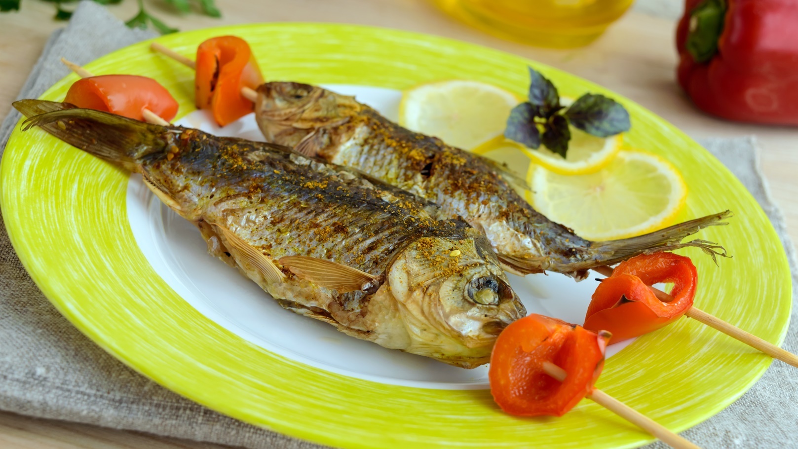 fried-fish-carp-on-skewers-with-pieces-pepper-an-2022-01-31-03-14-48-utc