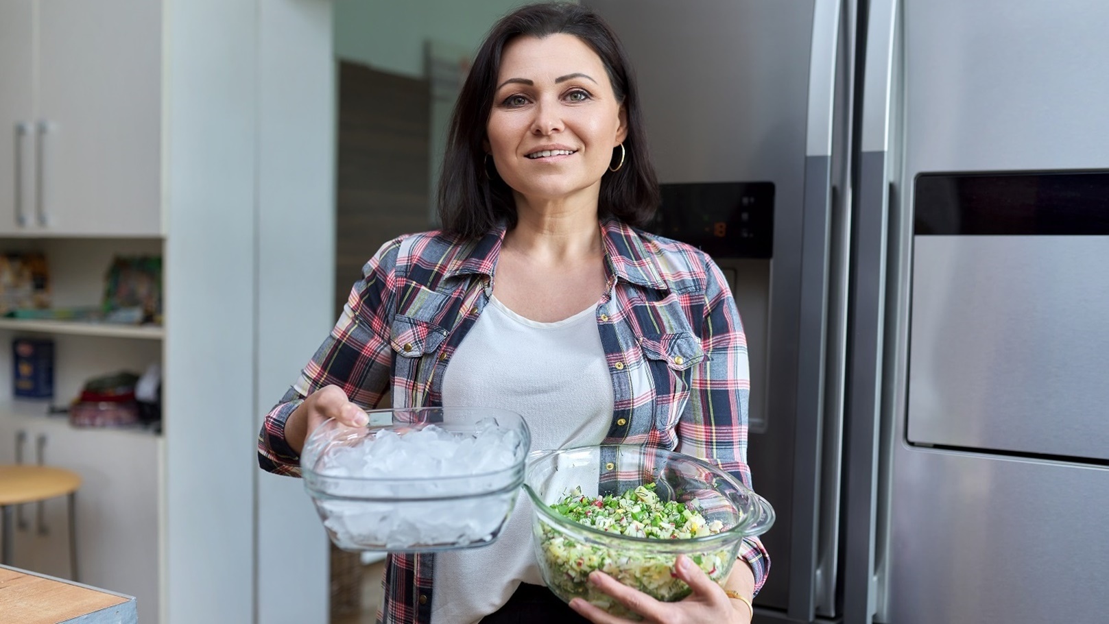 middle-aged-woman-in-the-kitchen-with-salad-and-a-2021-11-11-19-25-09-utc