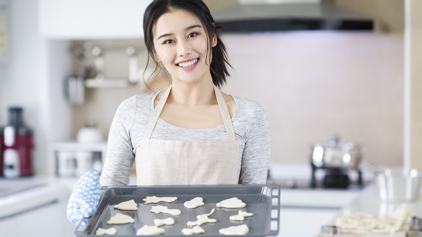 young-woman-making-cookies-in-kitchen-2022-03-25-01-00-24-utc