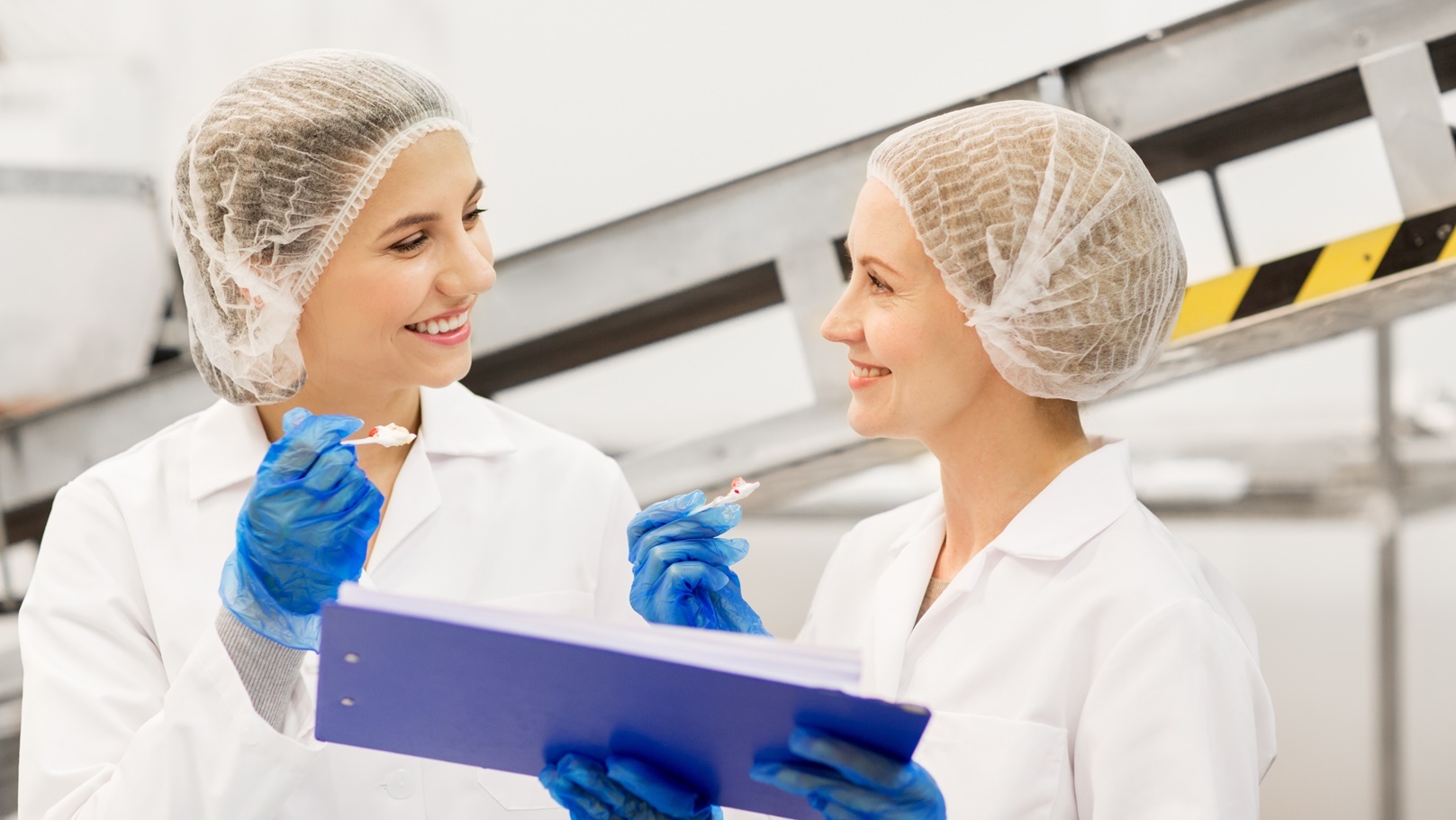 women-technologists-tasting-ice-cream-at-factory-2021-08-26-22-50-16-utc (1)