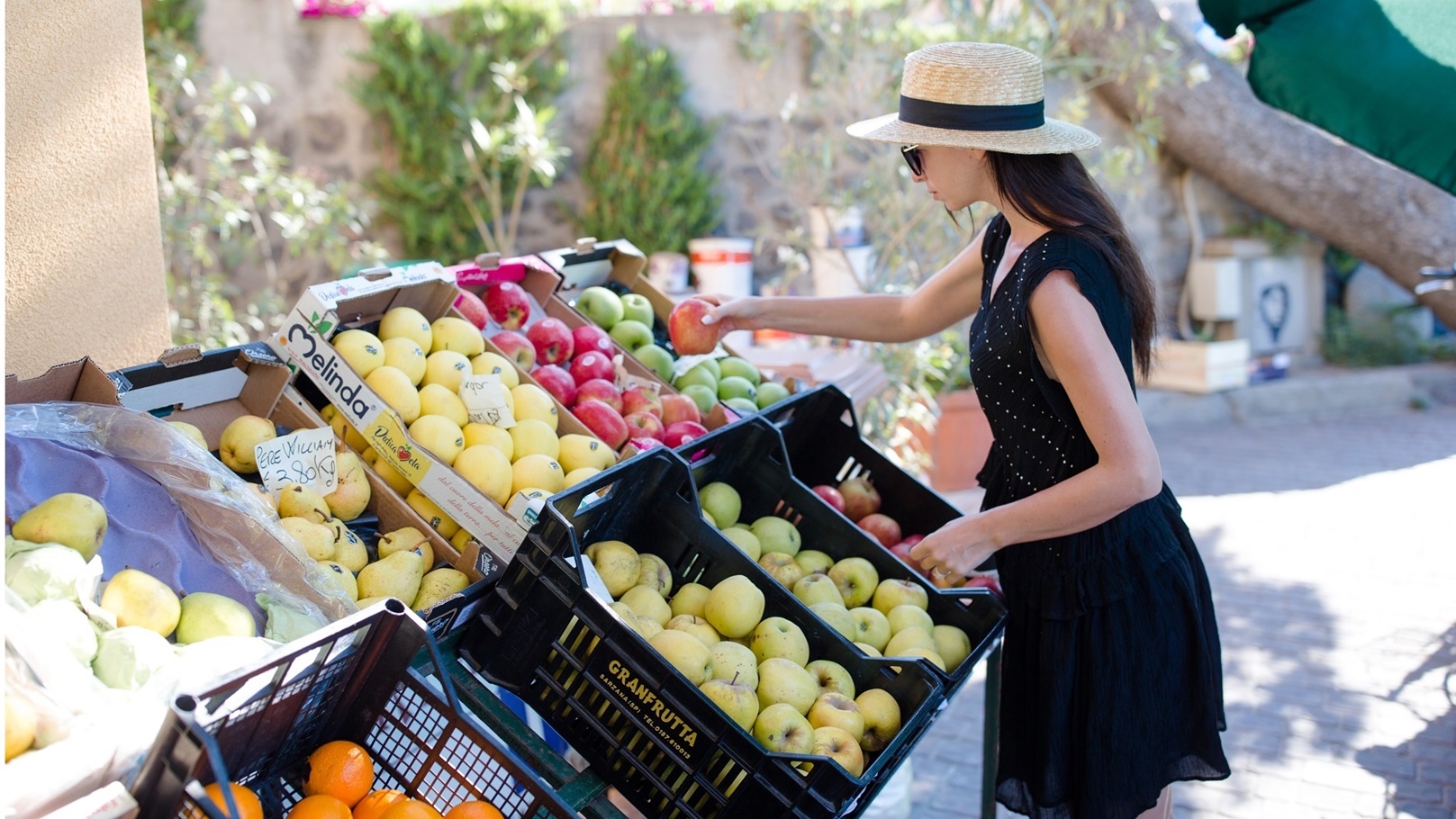 woman-buying-fruits-and-vegetables-at-farmers-outd-2022-04-01-15-45-12-utc