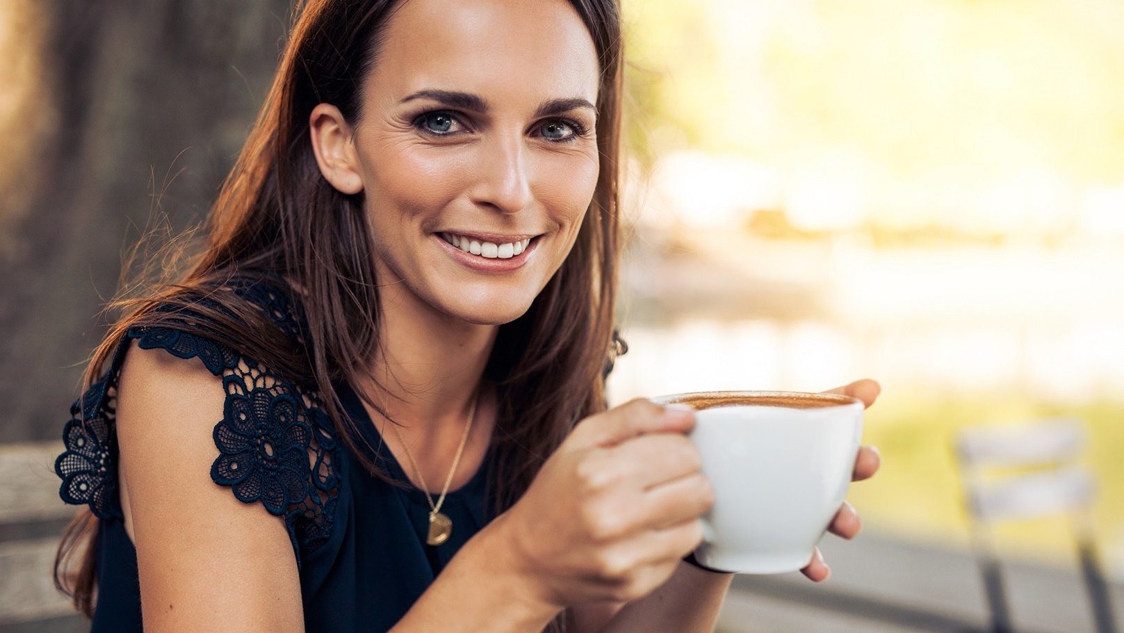 smiling-young-woman-with-a-cup-of-coffee-2021-08-26-19-58-03-utc