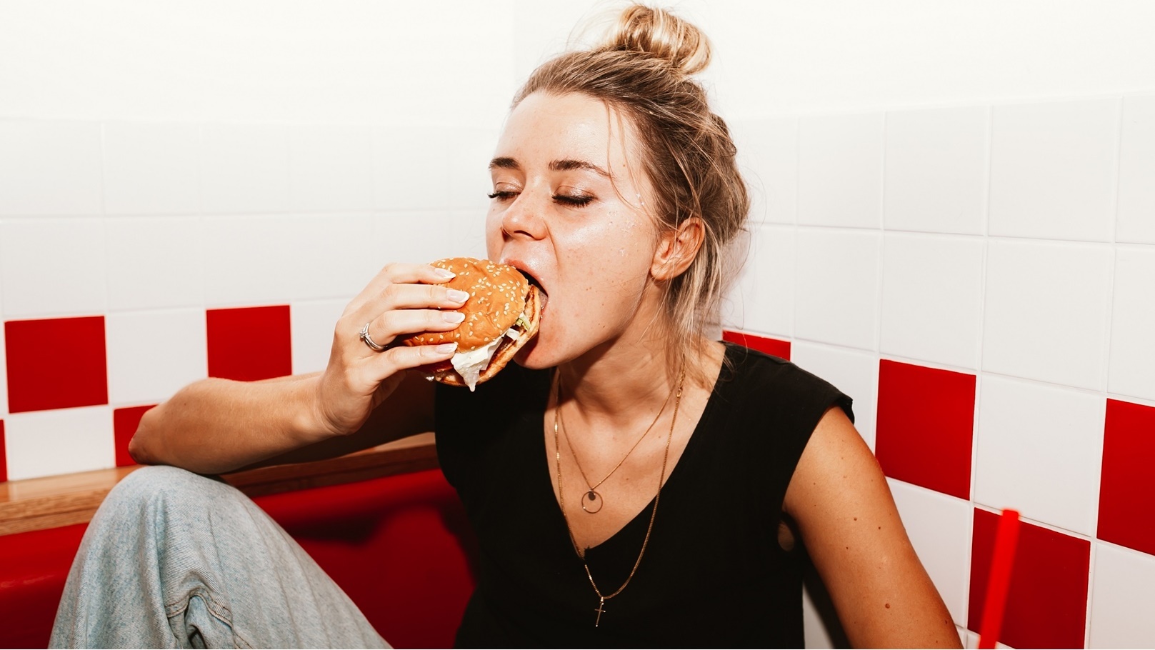 tiny-girl-eating-burger-and-french-fries-drinking-2021-08-29-15-11-30-utc