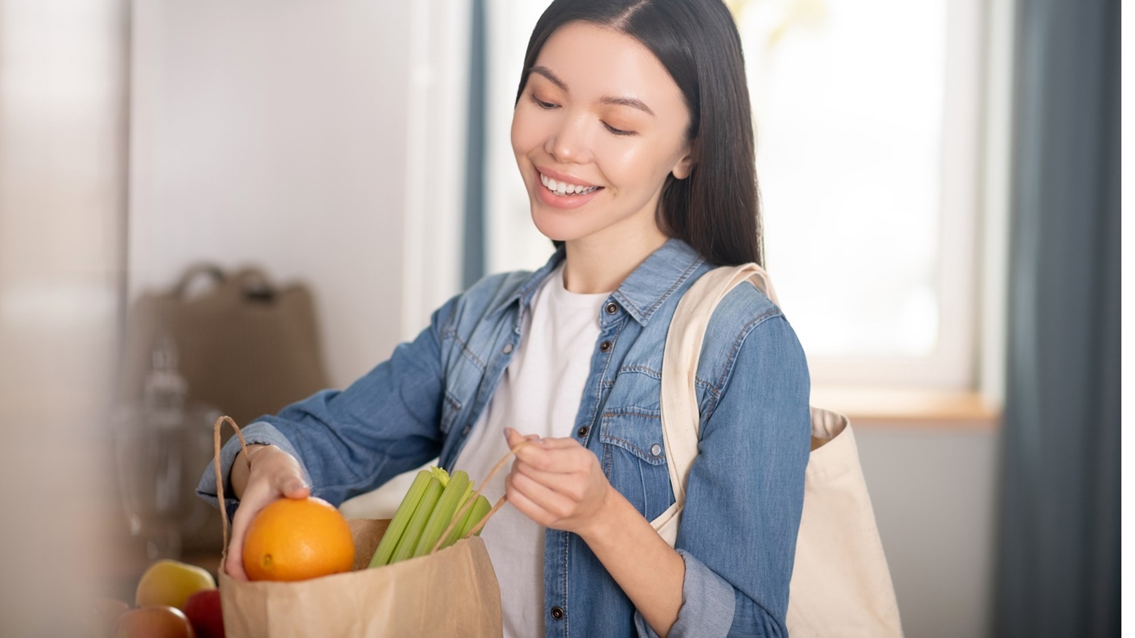beautiful-young-woman-with-paper-bag-of-vegetables-2021-09-04-09-21-31-utc