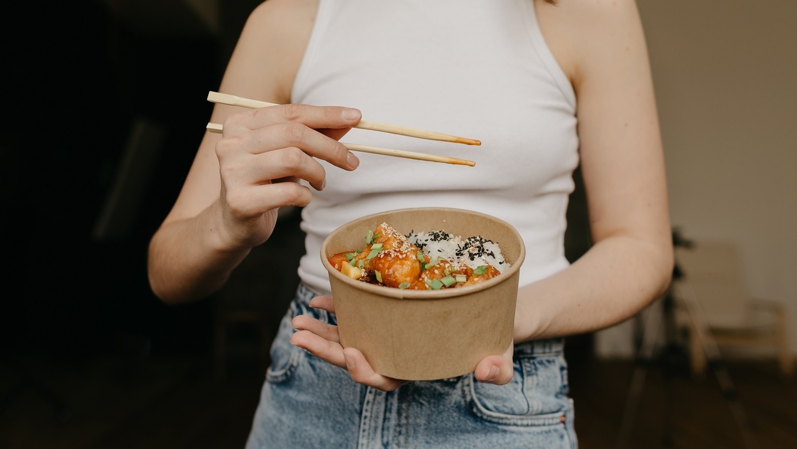 woman-holding-delivered-food-in-package-chicken-a-2022-04-13-07-37-59-utc