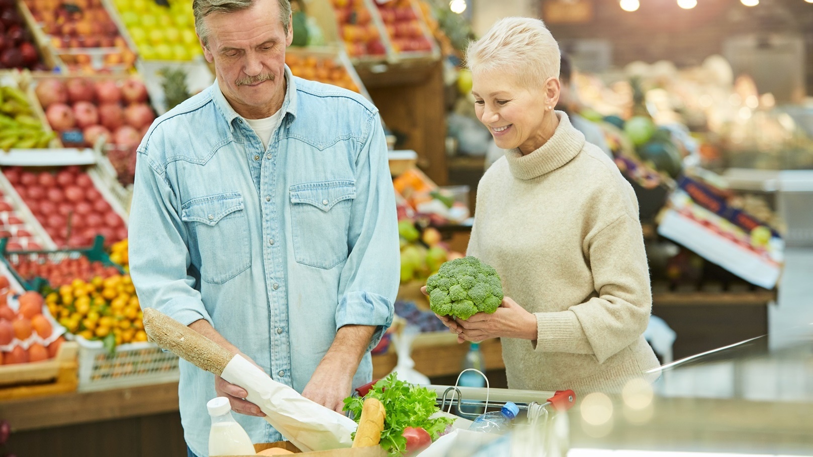 senior-couple-buying-groceries-in-supermarket-2022-02-02-04-51-30-utc