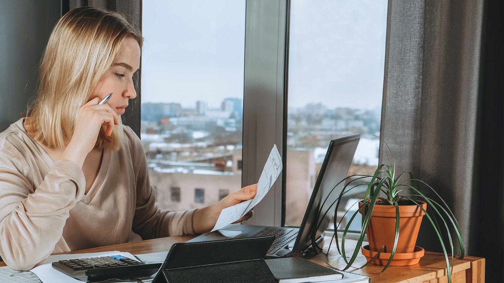 investments-young-woman-investor-buys-stocks-on-t-2022-01-12-05-19-48-utc