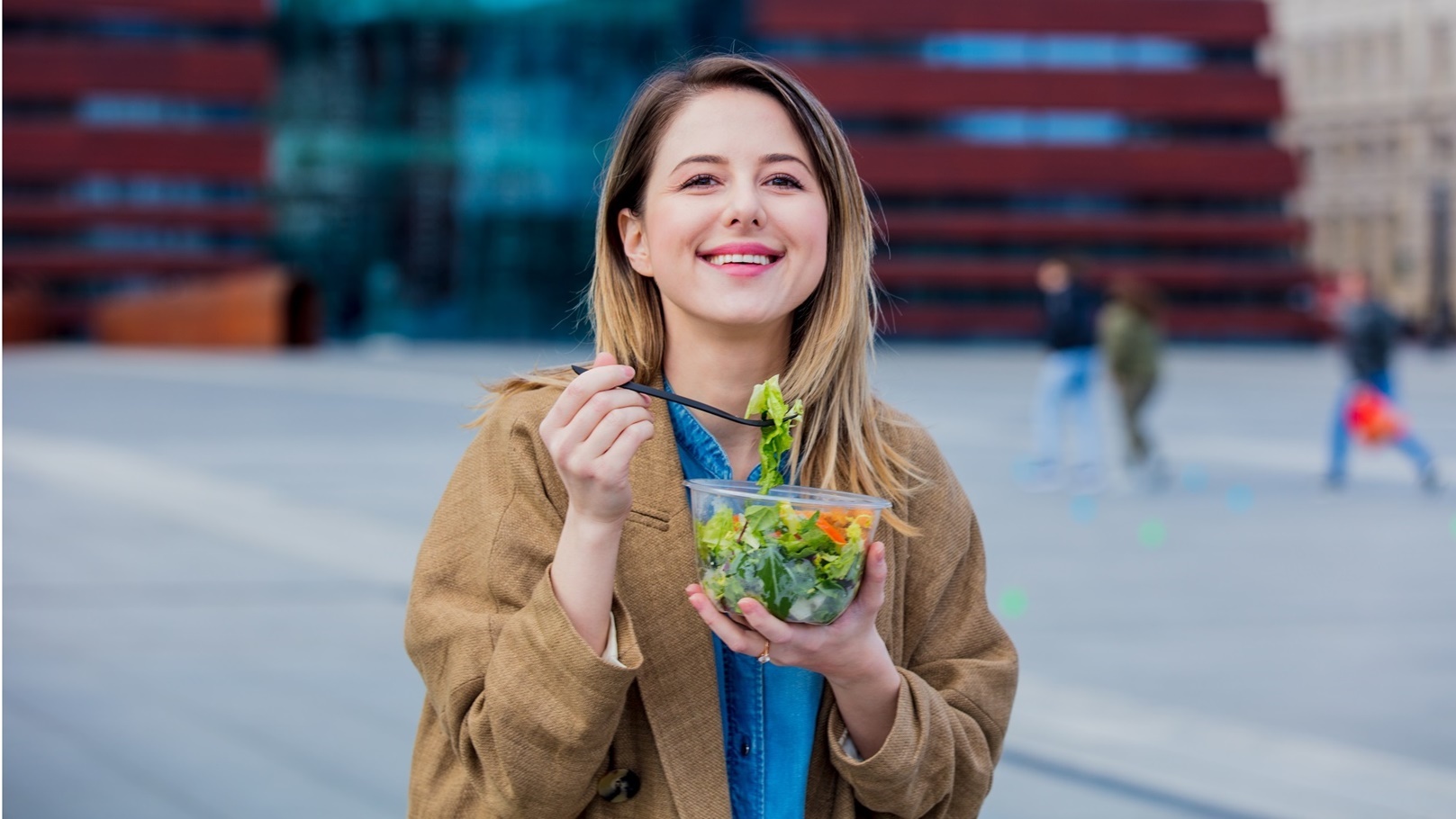 young-businesswoman-with-salad-at-urban-city-outdo-2022-01-12-05-09-30-utc