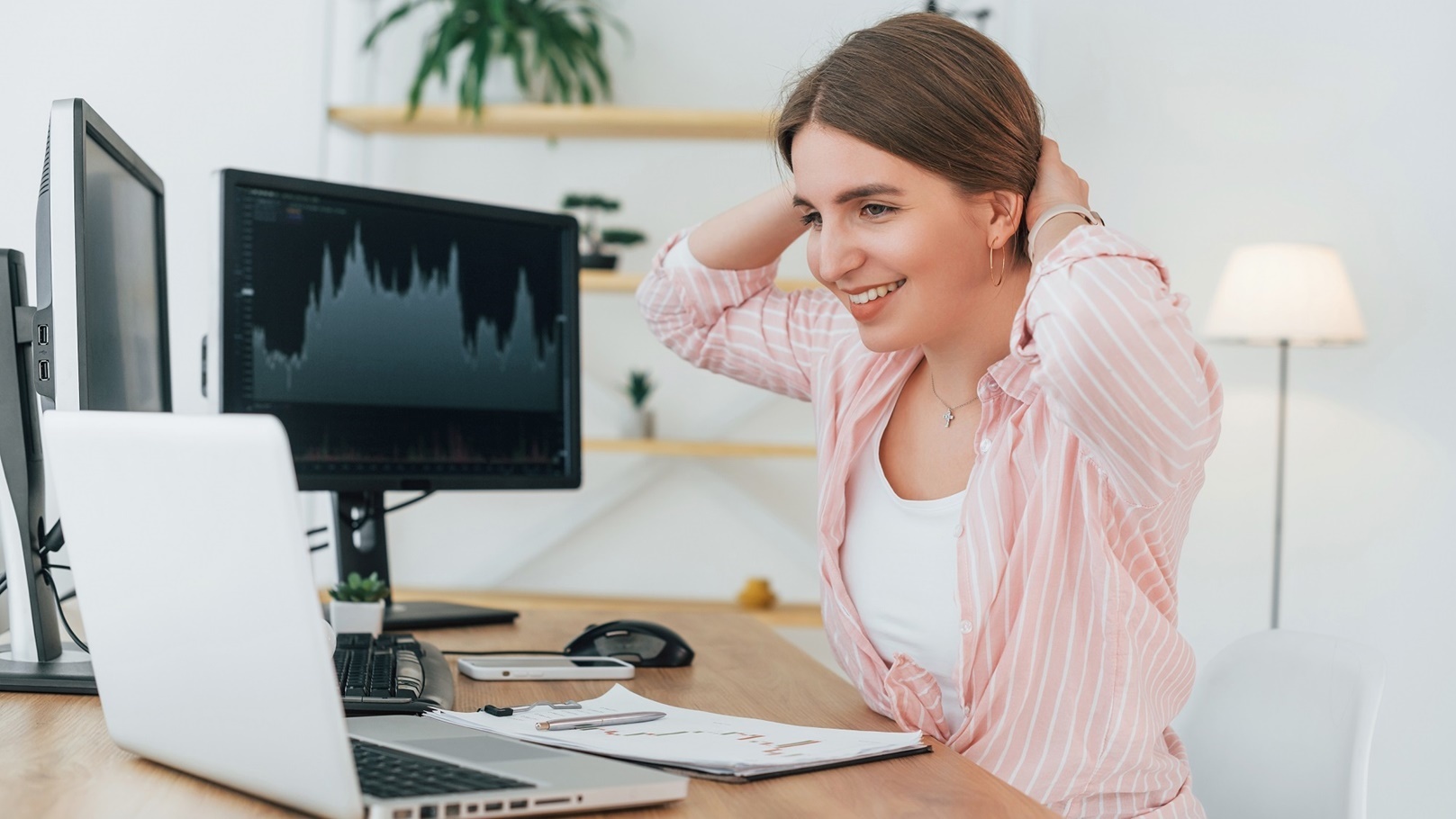 positive-female-stock-broker-in-casual-clothes-is-2022-06-06-16-58-12-utc