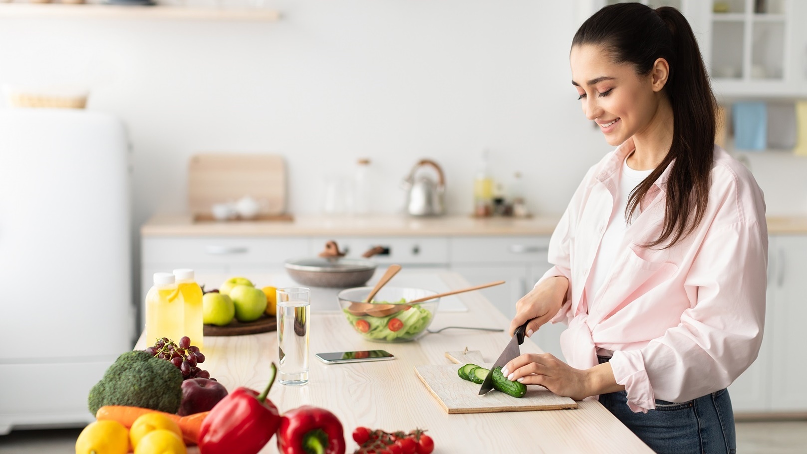 portrait-of-smiling-young-lady-cooking-fresh-salad-2021-09-03-14-33-10-utc