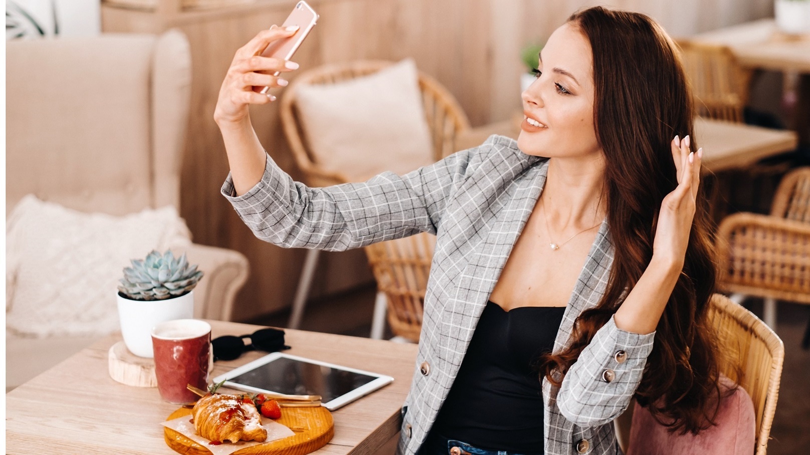 a-business-girl-is-sitting-in-a-cafe-and-taking-a-2022-01-05-22-27-15-utc