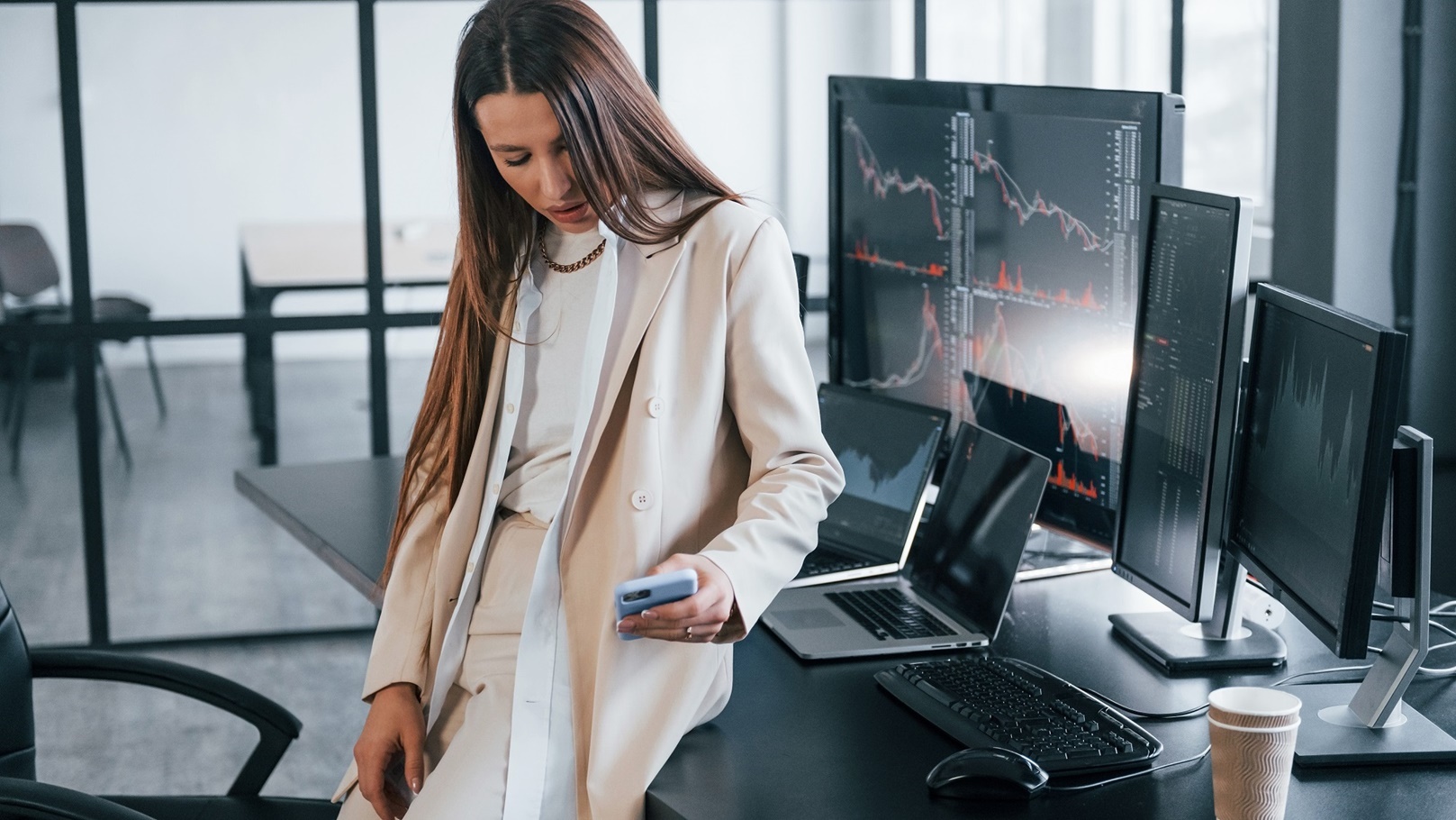 young-female-stock-brocker-is-indoors-in-the-offic-2021-09-03-03-36-55-utc