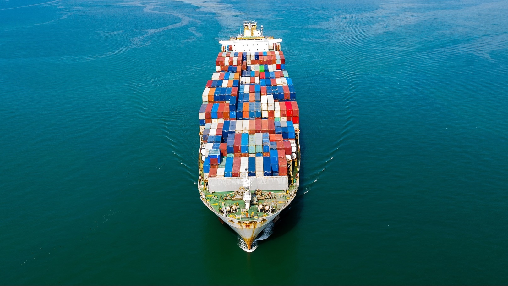 aerial-top-view-of-cargo-ship-carrying-container-f-2022-03-12-07-26-13-utc