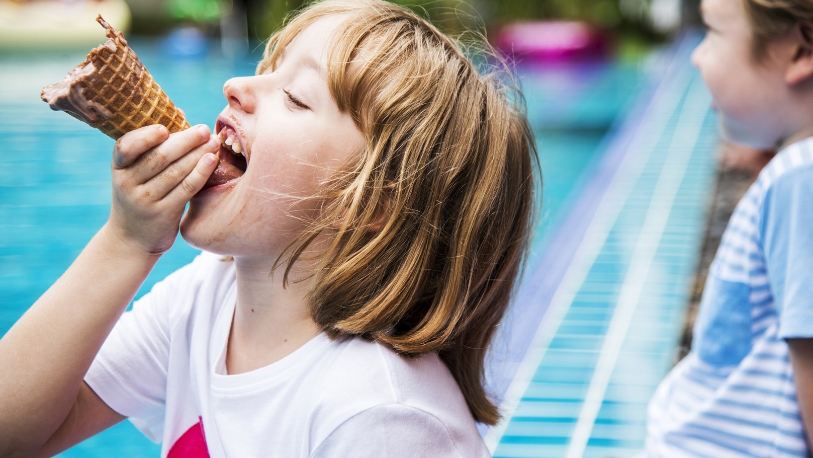 closeup-of-caucasian-girl-eating-ice-cream-by-the-2022-02-02-05-06-48-utc