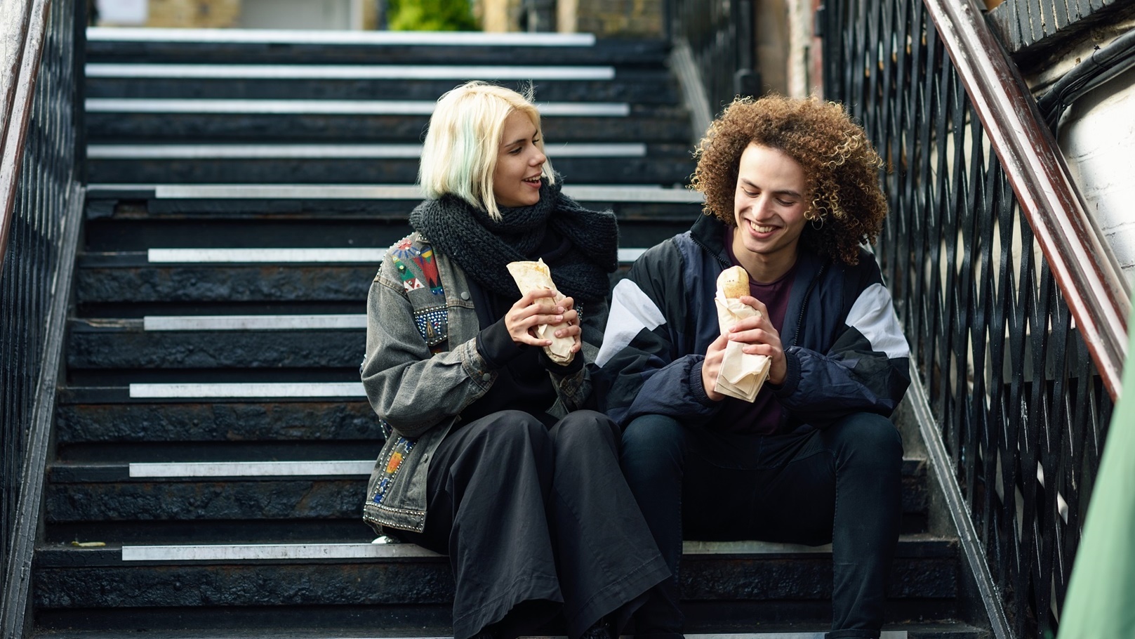 happy-couple-eating-doner-kebab-shawarma-in-camd-2021-08-26-20-00-06-utc