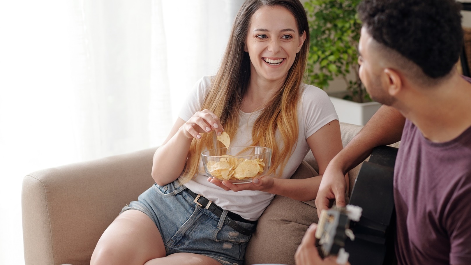 laughing-woman-eating-potato-chips-2021-12-09-05-02-32-utc