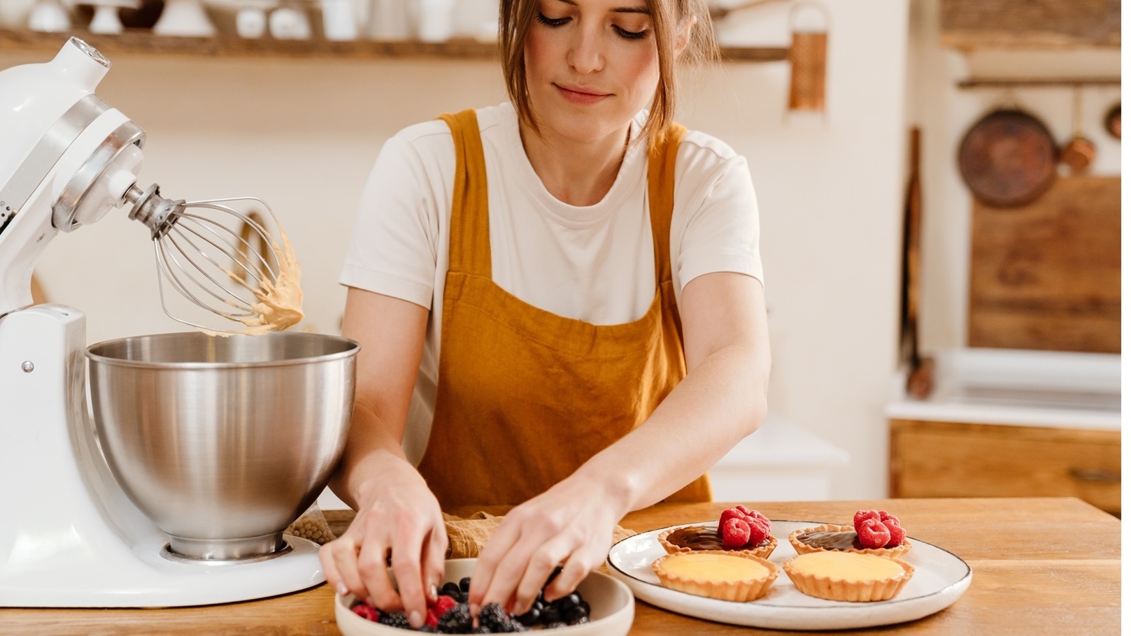 beautiful-concentrated-pastry-chef-woman-making-ta-2022-02-01-22-36-35-utc