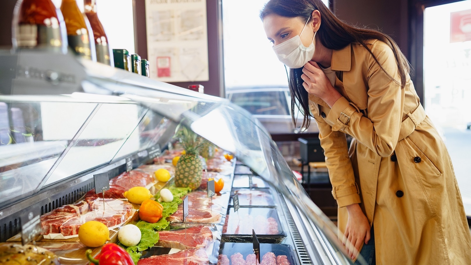 happy-young-woman-in-face-mask-choosing-meat-from-2022-03-05-20-22-02-utc (1)