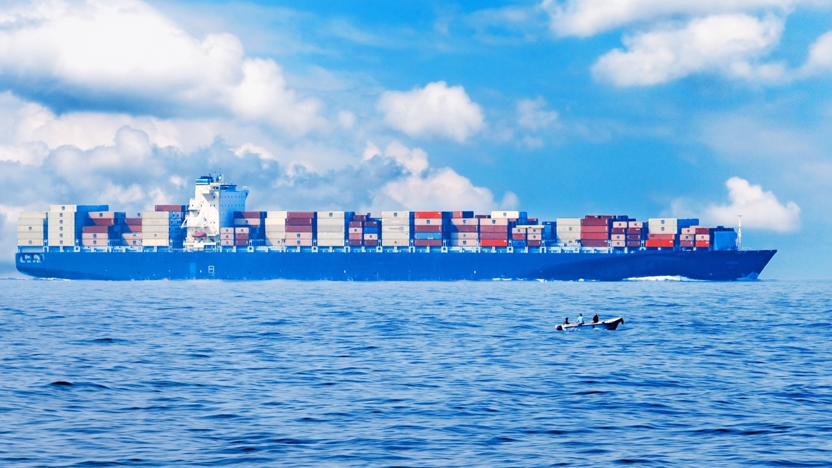 fully-loaded-cargo-ship-in-the-ocean-2021-09-02-12-18-35-utc