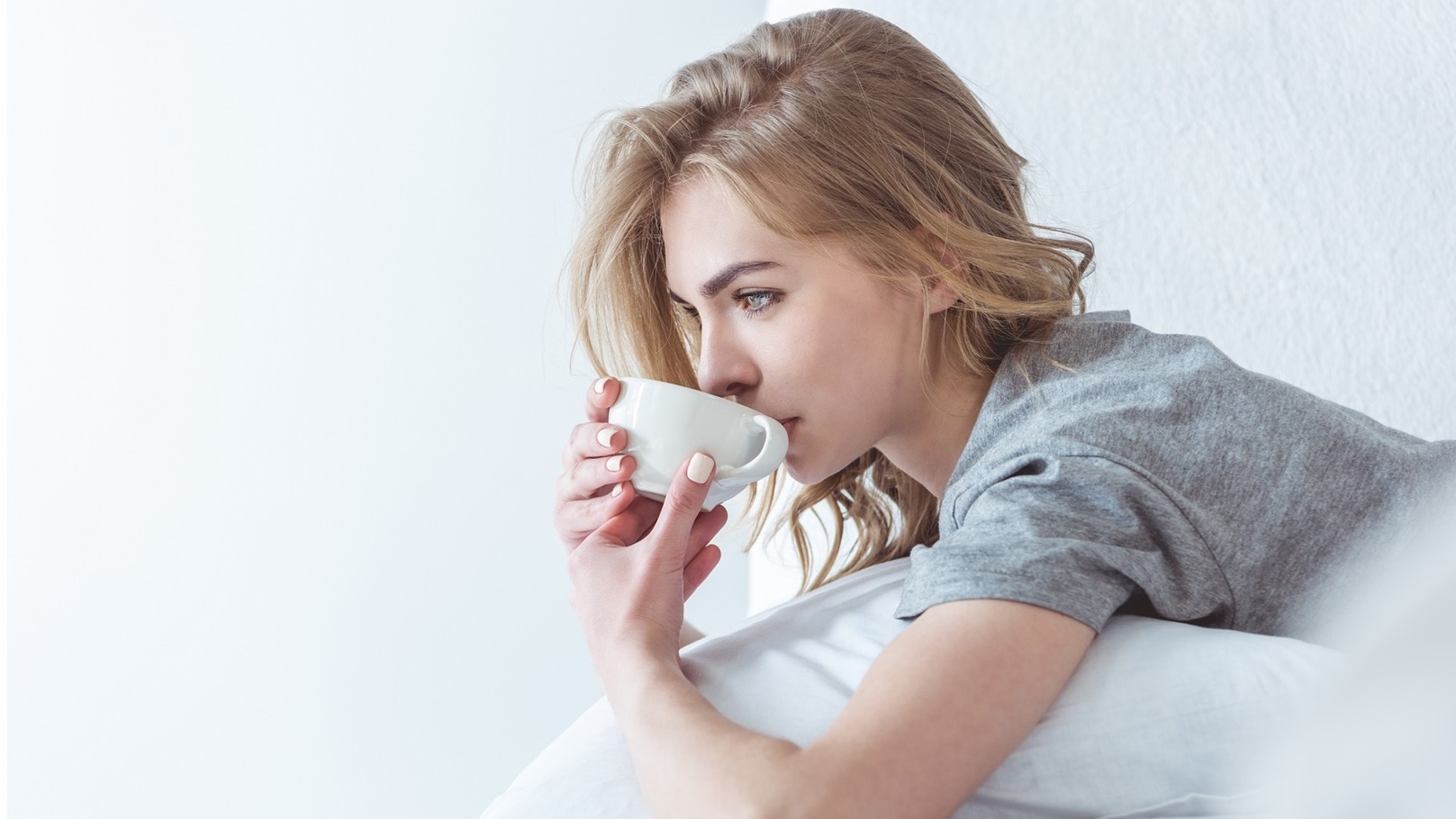 beautiful-pensive-woman-drinking-coffee-and-relaxi-2022-04-20-14-28-58-utc (1)