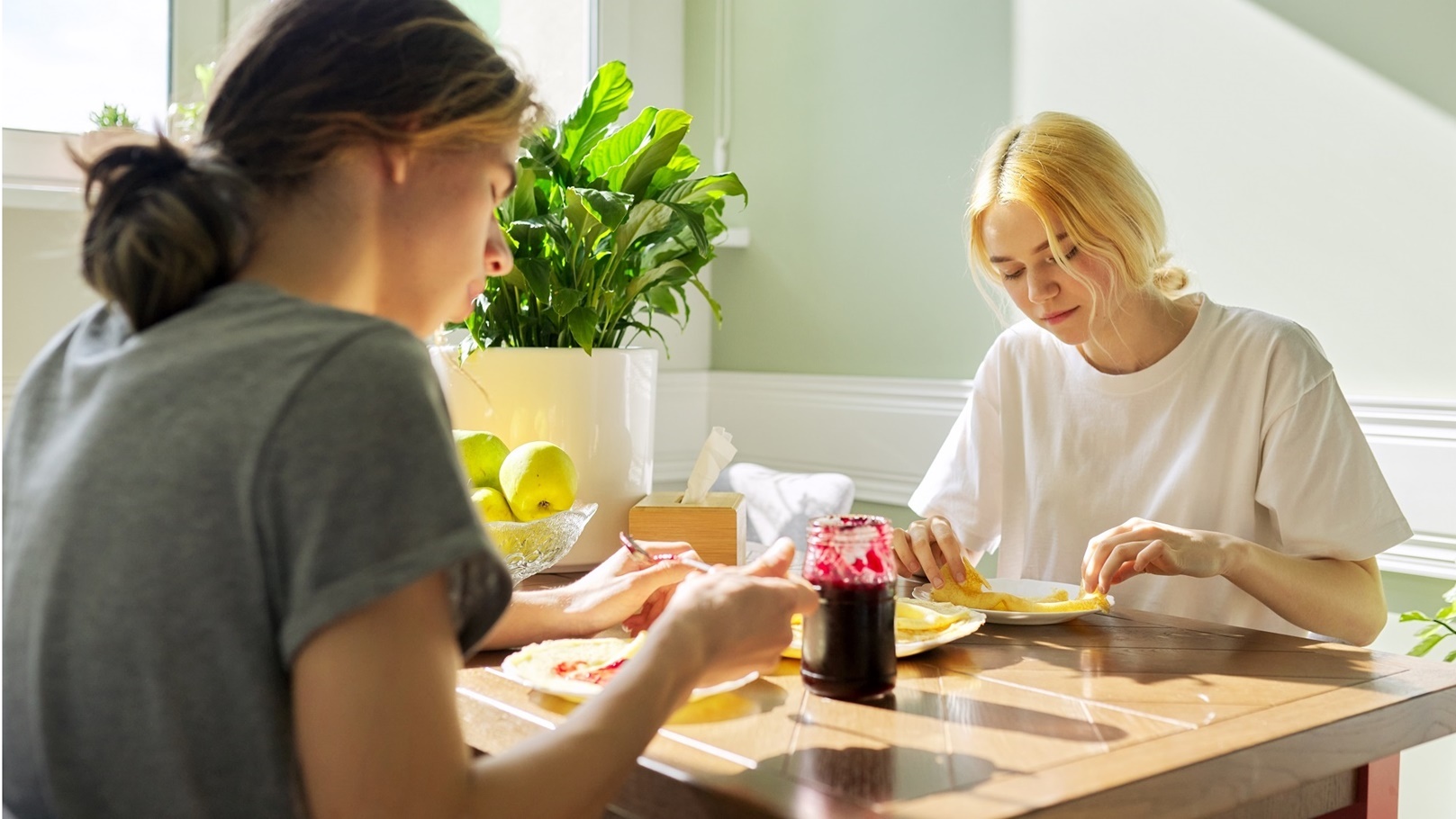 teenagers-guy-and-girl-eating-pancakes-with-jam-s-2022-01-14-00-05-57-utc