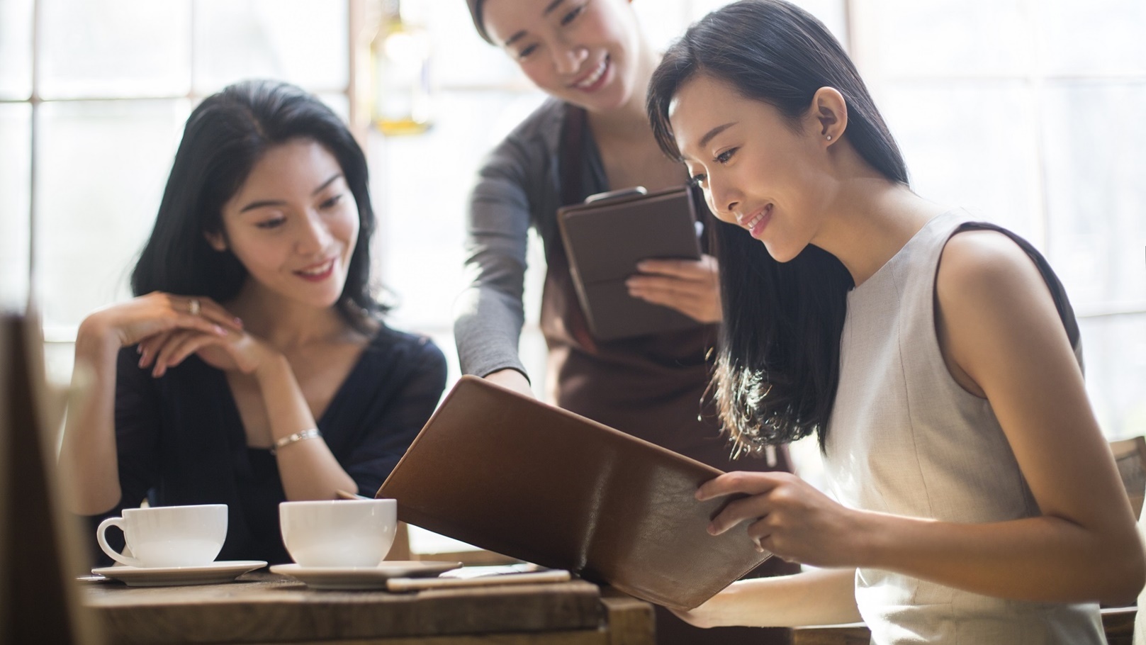 best-female-friends-drinking-coffee-in-cafe-2022-03-24-22-29-42-utc