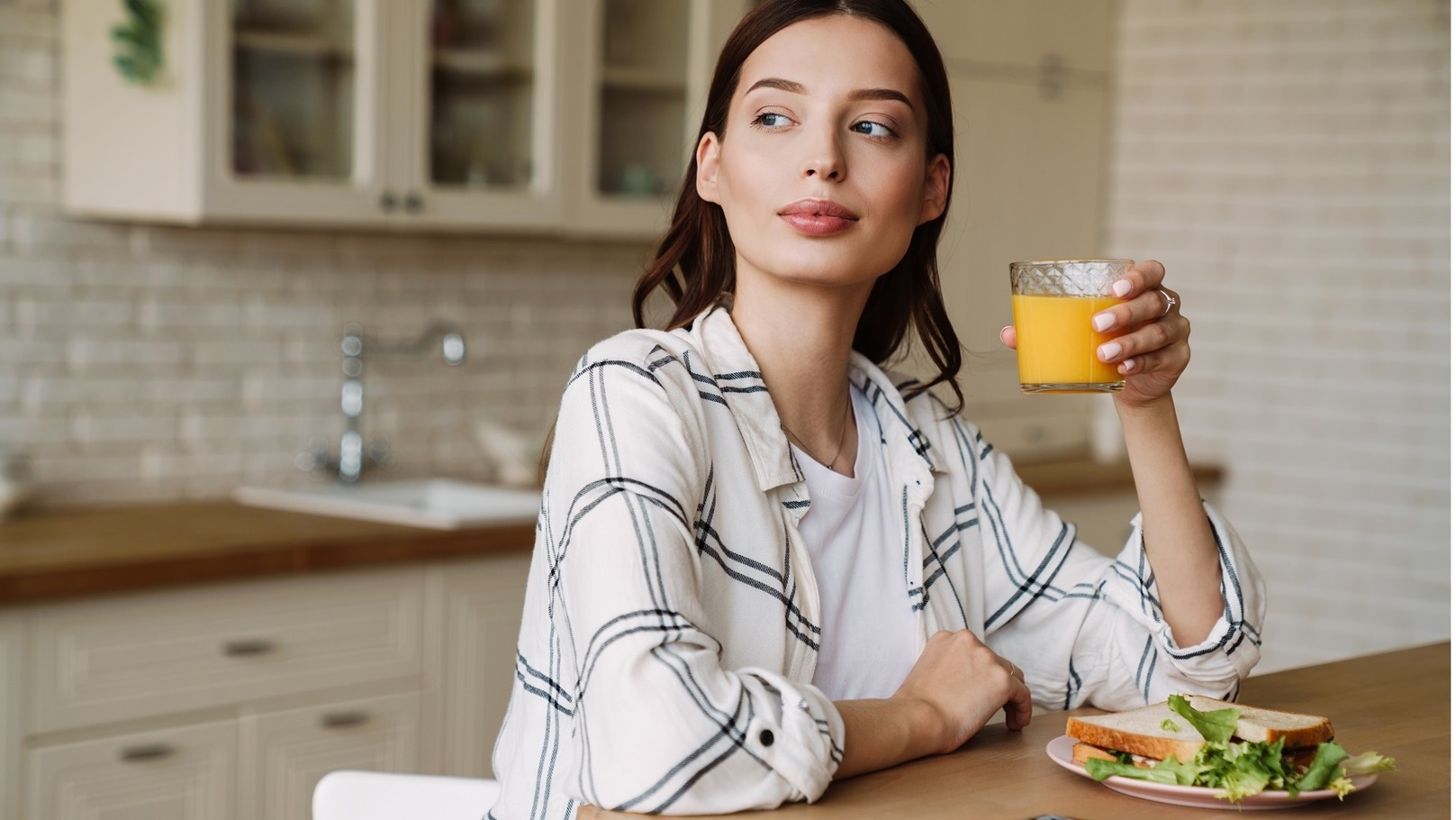 beautiful-serious-woman-drinking-coffee-while-havi-2022-02-01-22-37-47-utc