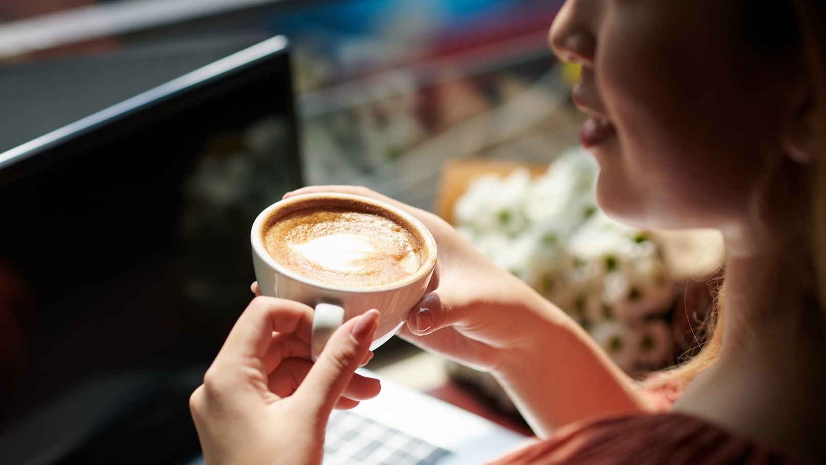 woman-drinking-coffee-in-coffeeshop-2022-01-27-19-22-15-utc