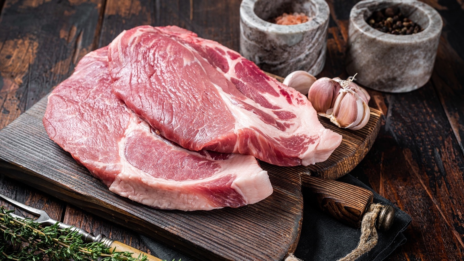 butcher-raw-pork-steak-from-raw-neck-fillet-meat-o-2021-12-15-20-52-21-utc