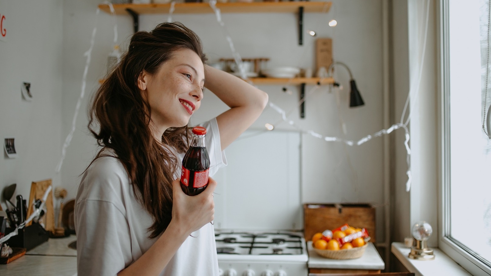 woman-at-the-kitchen-with-coke-paper-garland-and-2022-01-06-22-49-23-utc