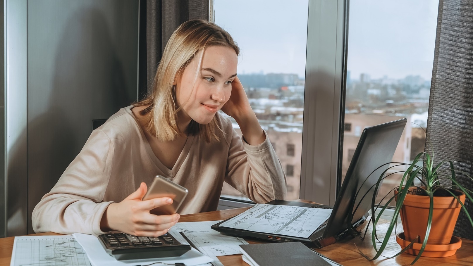 investments-young-woman-investor-buys-stocks-on-t-2022-02-15-19-18-19-utc