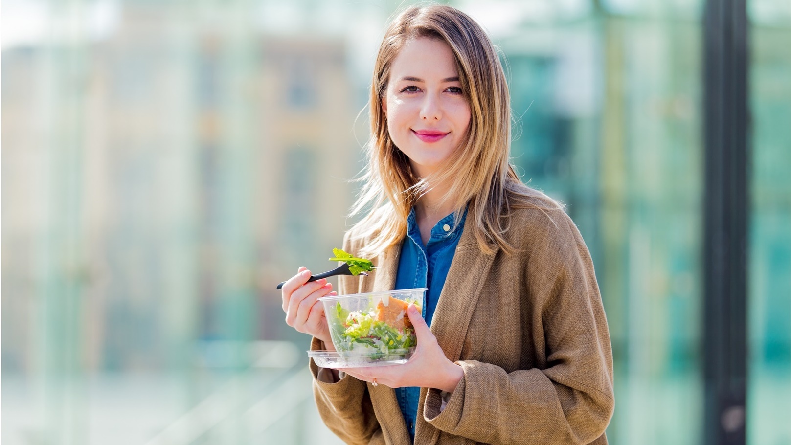 young-businesswoman-with-salad-at-urban-city-outdo-2022-01-12-04-59-12-utc