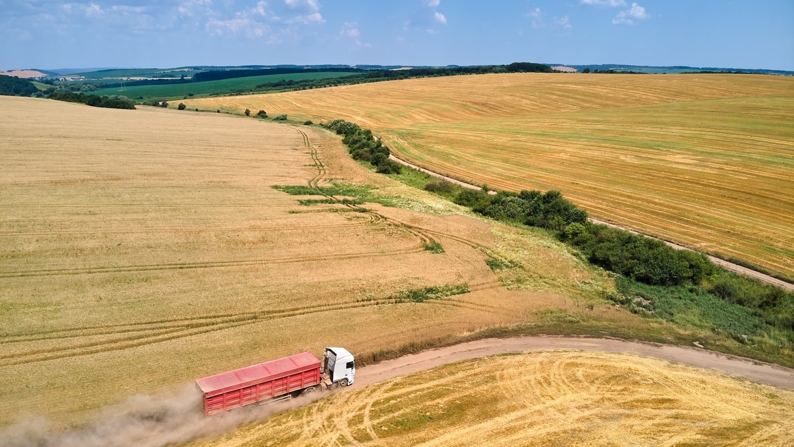 aerial-view-of-lorry-cargo-truck-driving-on-dirt-r-2022-01-31-14-19-21-utc