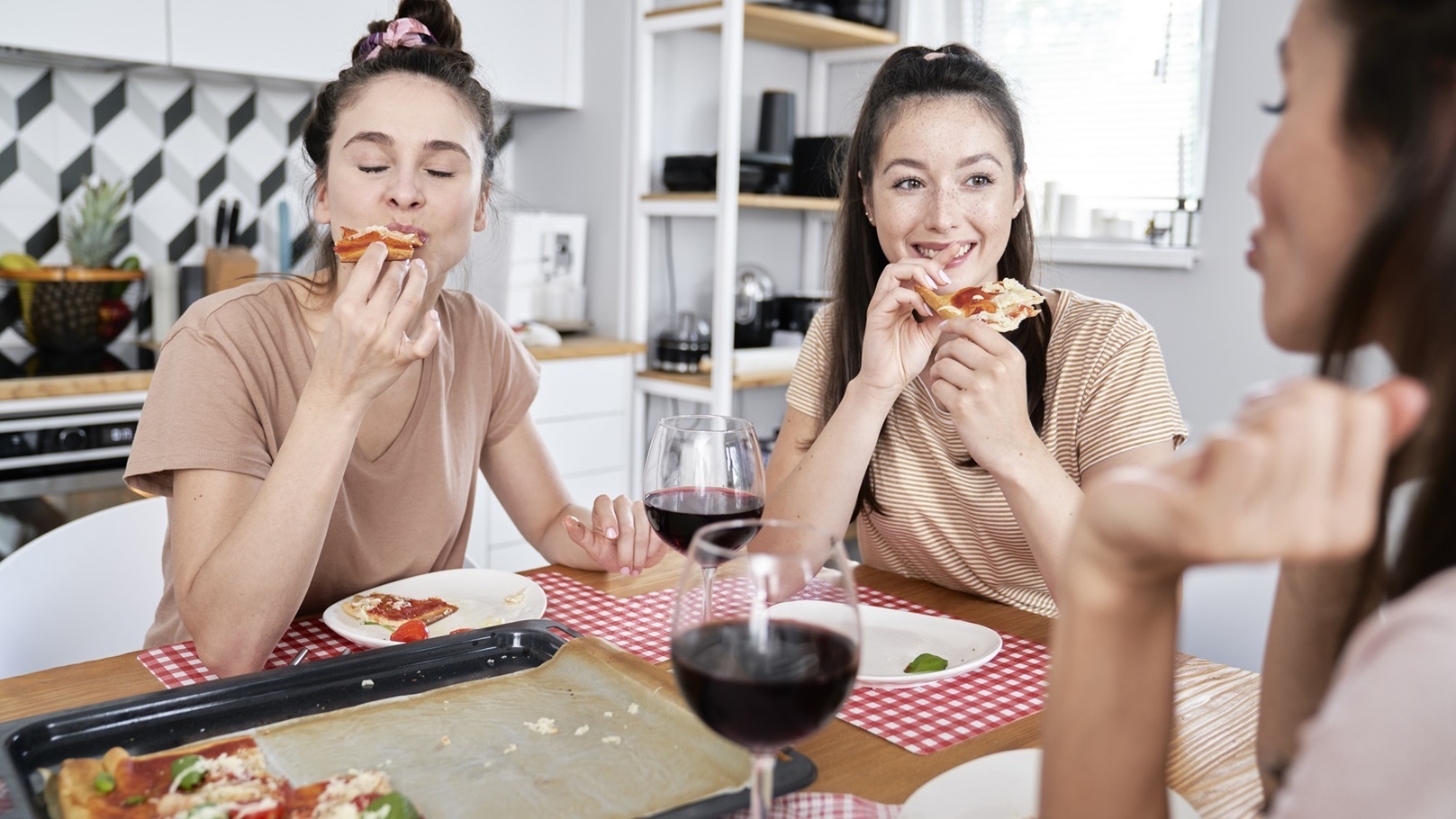 friends-eating-delicious-homemade-pizza-2021-08-29-01-51-39-utc