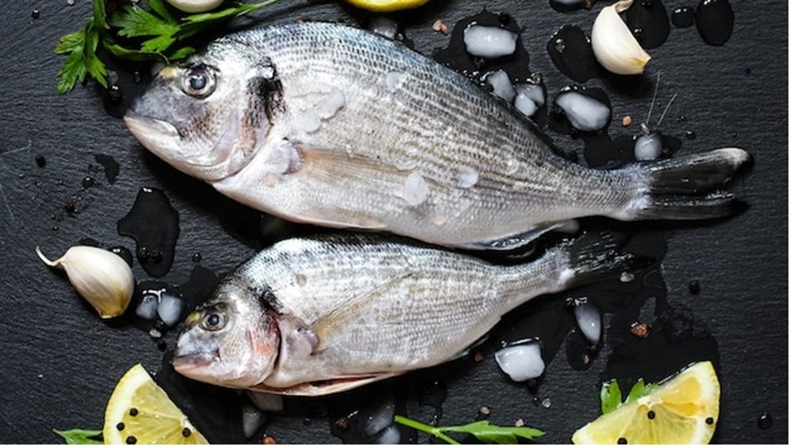 fresh-fish-orata-black-stone-with-vegetables_105895-197