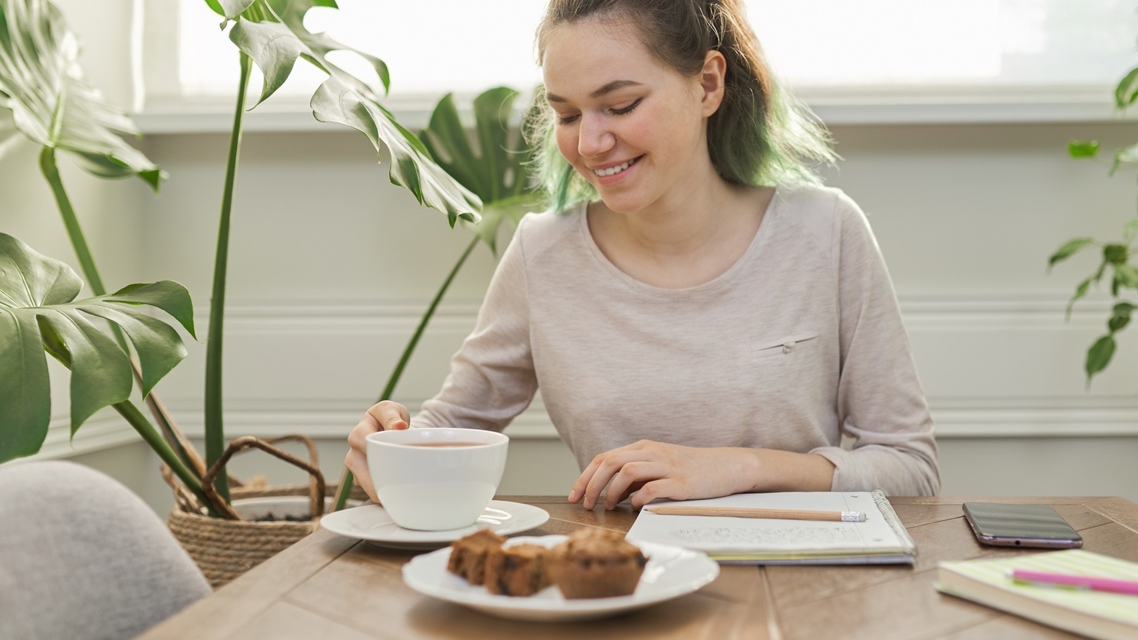 teen-girl-eating-cupcakes-drinking-tea-sitting-a-2022-01-13-23-30-29-utc (2)