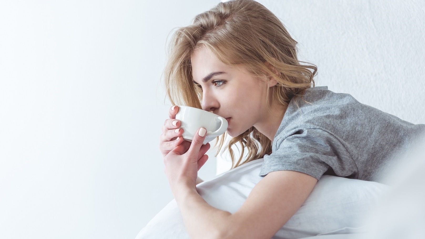 beautiful-pensive-woman-drinking-coffee-and-relaxi-2022-04-20-14-28-58-utc (1)